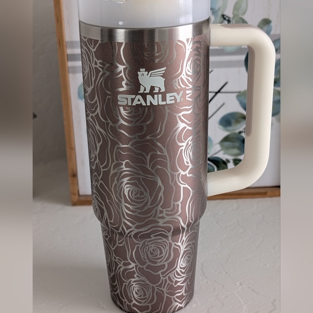 30 oz Rose quartz Glow Stanley with flowers engraved.